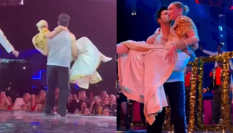 Varun Dhawan kissed and lifted a Hollywood actress Gigi Hadid during a performance on stage